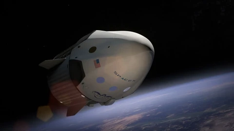 A SpaceX rocket launching into the sky with a trail of smoke.
