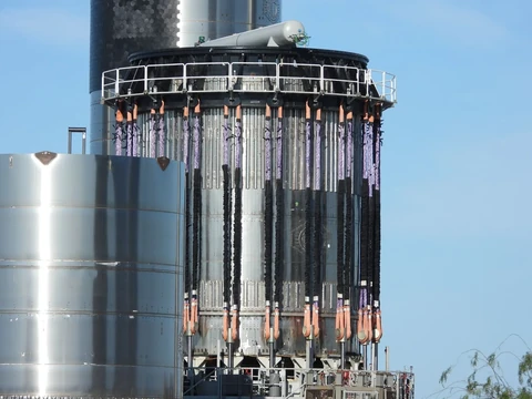 A large rocket prepared on a launchpad ahead of an orbital test flight.